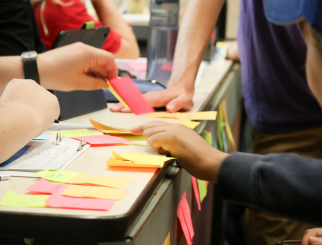 young people working with sticky notes